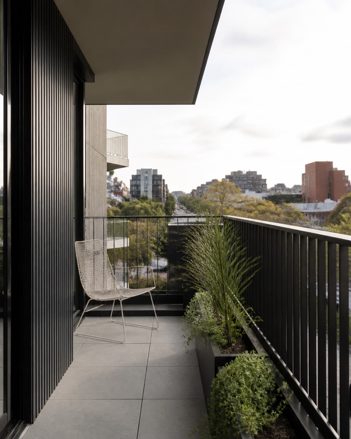 Balcony renovation concept with charcoal balustrade and native planting